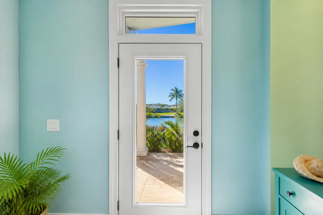 A rear door with a small glazed transom above it in an interior wall